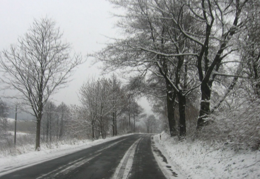 truck driving on snowy road